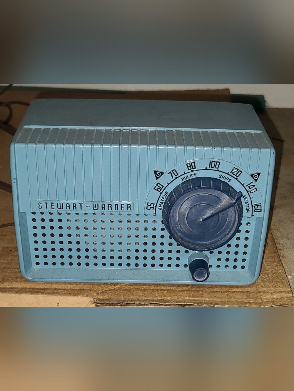 vintage Stewart-Warner Tube radio model 9181 with blue outer shell.